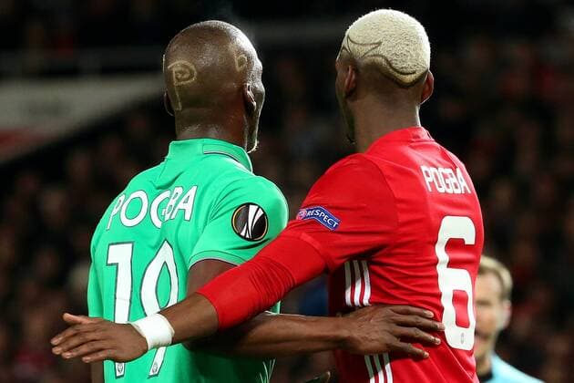 Florentin Pogba of Saint Etienne holds on to Paul Pogba of Manchester United ManU during the UEFA Europa League Round of 32 1st leg match at Old Trafford Stadium, Manchester. Picture date: February 16th, 2017. Pic credit should read: Matt McNulty Sportimage EDITORIAL USE ONLY. No use with unauthorised audio, video, data, fixture lists, club league logos or live services. Online in-match use limited to 120 images, no video emulation. No use in betting, games or single club league player publications.
