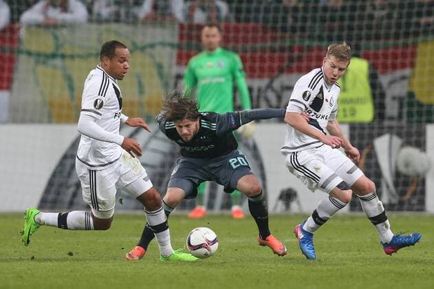 February 16th 2017, sports, Polish Army Stadium, Warsaw, Poland; Lasse Schone (Ajax), Vadis Odjidja Ofoe (Legia), Michal Kopczynski (Legia) at the Legia Warsaw versus Ajax Amsterdam, UEFA Europa League tie xTomaszxJastrzebowskix  ActionPlus11847055