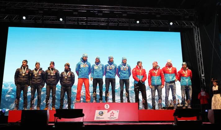 HOCHFILZEN, AUSTRIA - FEBRUARY 18, 2017: Silver medallists Martin Fourcade, Simon Desthieux, Quentin Fillon Maillet, and Jean Guillaume Beatrix of France, gold medallists Anton Shipulin, Anton Babikov, Maxim Tsvetkov, and Alexei Volkov of Russia, bronze medallists Dominik Landertinger, Simon Eder, Julian Eberhard, Daniel Mesotitsch of Austria, from left, pose at a victory ceremony for the men s 4x7.5km relay at the 2017 IBU Biathlon World Championships in Hochfilzen, Austria. Stanislav Krasilnikov TASS  TS041D22