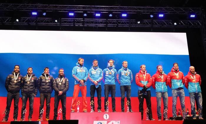 HOCHFILZEN, AUSTRIA - FEBRUARY 18, 2017: Silver medallists Martin Fourcade, Simon Desthieux, Quentin Fillon Maillet, and Jean Guillaume Beatrix of France, gold medallists Anton Shipulin, Anton Babikov, Maxim Tsvetkov, and Alexei Volkov of Russia, bronze medallists Dominik Landertinger, Simon Eder, Julian Eberhard, Daniel Mesotitsch of Austria, from left, pose at a victory ceremony for the men s 4x7.5km relay at the 2017 IBU Biathlon World Championships in Hochfilzen, Austria. Stanislav Krasilnikov TASS  TS041D24