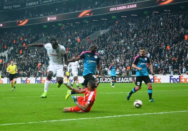Besiktas Vincent Aboubakar kick the ball over Hapoel Beer-Sheva s goal keeper during UEFA European League Game at Istanbul Vodafone Arena.  15635024