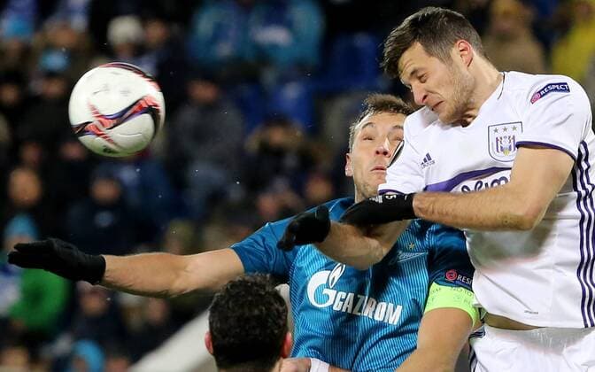 ST PETERSBURG, RUSSIA - FEBRUARY 23, 2017: Zenit St Petersburgâ€™s Artem Dzyuba (L) and RSC Anderlecht Brusselsâ€™ Uros Spajic fight for the ball in their 2016-17 UEFA Europa League Round of 32, 2nd leg football match at Petrovsky Stadium. Zenit St Petersburg won the game 3-1. Alexander Demianchuk TASS  TS042637