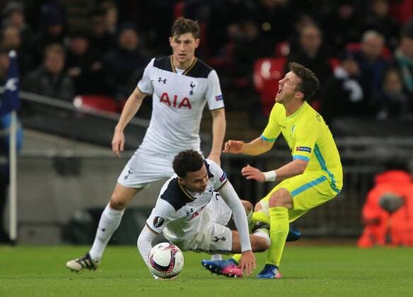 Brecht Dejaeghere of Gent is fouled by Dele Alli of Tottenham Hotspur - red card for Alli - during the UEFA Europa League Round of 32, Game 2 match between Tottenham Hotspur and KAA Gent played at Wembley , London on 23rd February 2017  mze_Tottenham_v_Gent_004