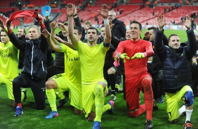 Football - 2016 2017 Europa League - Group of Thirty-Two, Second Leg: Tottenham Hotspur 0 vs. KAA Gent 1 Stefan Mitrovic and goalkeeper Lovre Kalinic lead the Gent team celebrations with the fans after the match at Wembley. COLORSPORT ANDREW COWIE 
