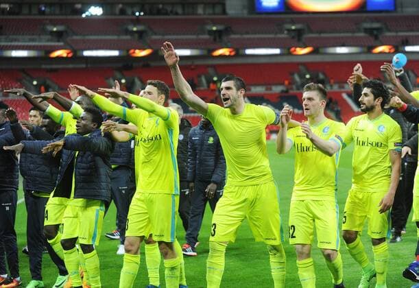 Football - 2016 2017 Europa League - Group of Thirty-Two, Second Leg: Tottenham Hotspur 0 vs. KAA Gent 1 Stefan Mitrovic leads the Gent team celebrations with the fans after the match at Wembley. COLORSPORT ANDREW COWIE 