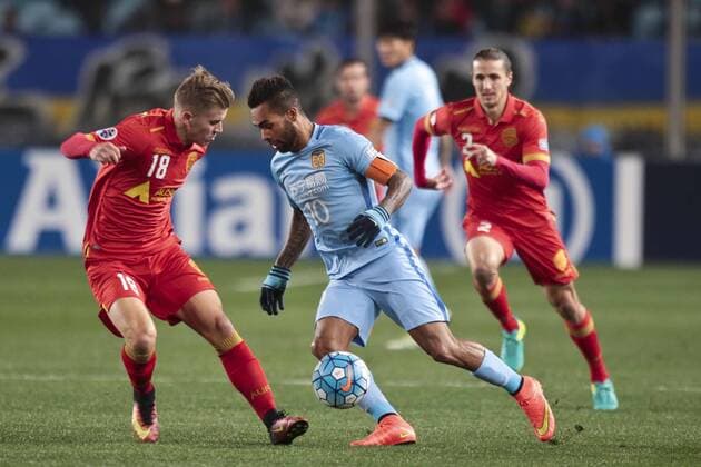 NANJING, CHINA - MARCH 01: Alex Teixeira 10 of Jiangsu Suning and Riley McGree 18 of Adelaide United vie for the ball during the AFC Champions League 2017 Group H match between Jiangsu Suning and Adelaide United at Nanjing Olympic Sports Centre on March 1, 2017 in Nanjing, Jiangsu Province of China.  Copyright: xVCGx CFP500820855 