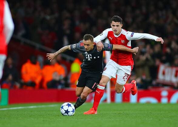 March 7th 2017, Emirates, London, England; UEFA Champions League football, Arsenal FC versus Bayern Munich; Rafinha of Bayern Munich and Granit Xhaka of Arsenal battle for possession during a Bayern Munich attack xMarkxKertonx  ActionPlus11854205