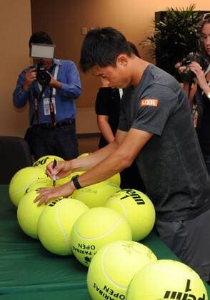 INDIAN WELLS, CA - MARCH 08: ATP Tennis Herren tennis player Kei Nishikori (JPN) autographs tennis balls during Player Media Day held during the BNP Paribas Open, on March, 8, 2017, at the Indian Wells Tennis Garden in Indian Wells, CA. (Photo by John Cordes Icon Sportswire) TENNIS: MAR 08 BNP Paribas Open Icon506170308010 EDITORIAL USE ONLY