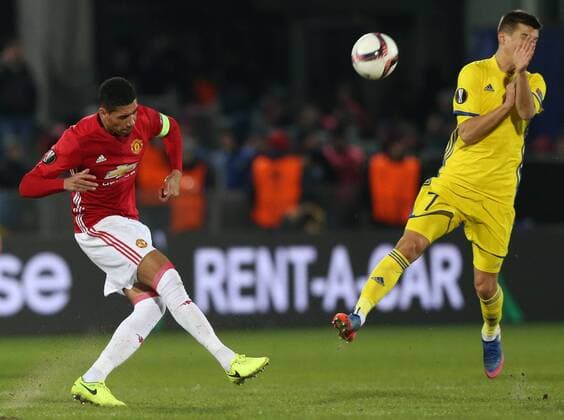 March 9, 2017 - Rostov-On-Don, Russia - Chris Smalling (L) of FC Manchester United ManU and Dmitri Poloz of FC Rostov vie for the ball during the UEFA Europa League Round of 16, first leg between FC Manchester United and FC Rostov, at Olimp 2 Stadium in Rostov-on-Don, Russia on March 9, 2017. FK Rostov v Manchester United - UEFA Europa League Round of 16: First Leg  - ZUMAn230 20170309_zaa_n230_257 Copyright: xIgorxRussakx