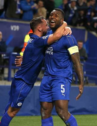 Wes Morgan of Leicester City (r) celebrates scoring the first goal during the UEFA Champions League Round of 16 - 2nd Leg match at the King Power Stadium, Leicester. Picture date: March 14th 2017. Pic credit should read: Simon Bellis Sportimage EDITORIAL USE ONLY. No use with unauthorised audio, video, data, fixture lists, club league logos or live services. Online in-match use limited to 120 images, no video emulation. No use in betting, games or single club league player publications.