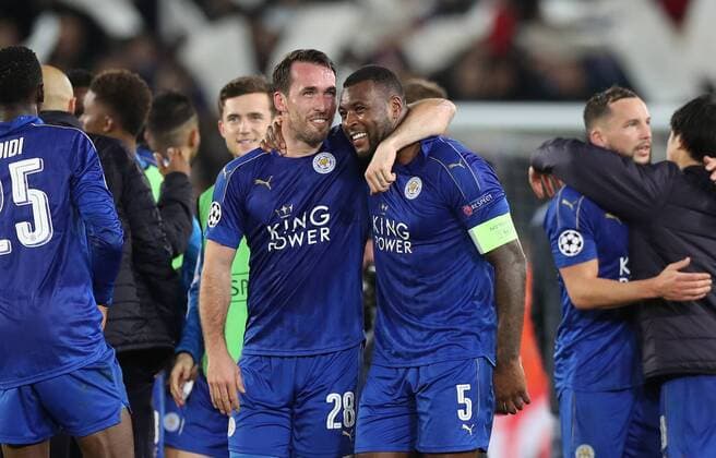 Fußball, CL, Leicester City - FC Sevilla Football - 2016 2017 UEFA Champions League - Round of Sixteen, Second Leg: Leicester City 1 vs. Sevilla 2 Wes Morgan of Leicester City and Christian Fuchs of Leicester City celebrate after the match at the King Power Stadium. 