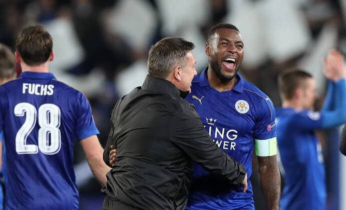 Football - 2016 2017 UEFA Champions League - Round of Sixteen, Second Leg: Leicester City 1 vs. Sevilla 2 Craig Shakespeare, Manager of Leicester City celebrates with Wes Morgan of Leicester City after the match at the King Power Stadium. 