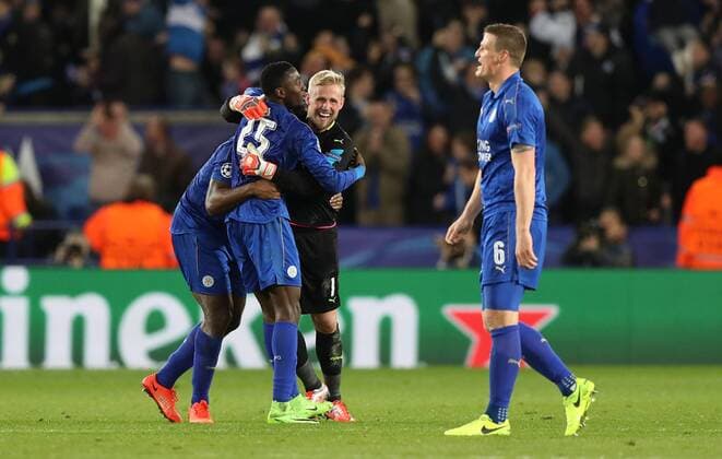 Football - 2016 2017 UEFA Champions League - Round of Sixteen, Second Leg: Leicester City 1 vs. Sevilla 2 Kasper Schmeichel and Wilfred Ndidi of Leicester City celebrate after the match at the King Power Stadium. 