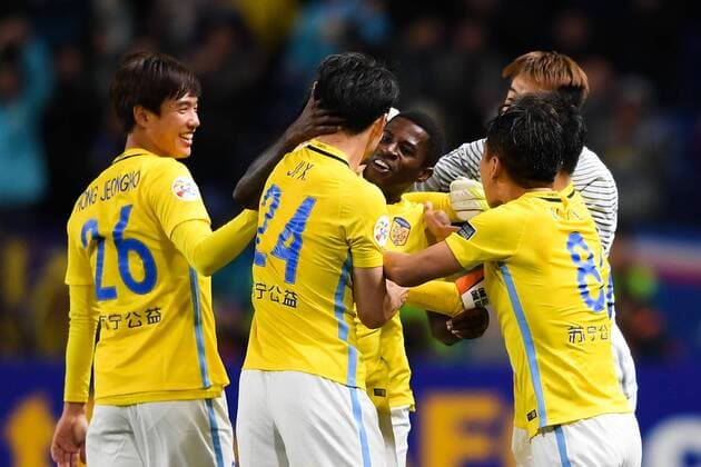 Players of China s Jiangsu Suning celebrate after scoring a goal against Japan s Gamba Osaka in their Group H match during the AFC Champions League 2017 in Osaka, Japan, 15 March 2017. Jiangsu Suning competes against Gamba Osaka at AFC group match  20170315_09253