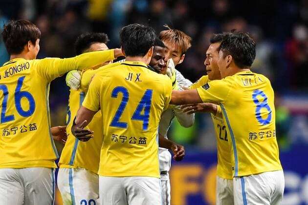 Players of China s Jiangsu Suning celebrate after scoring a goal against Japan s Gamba Osaka in their Group H match during the AFC Champions League 2017 in Osaka, Japan, 15 March 2017. Jiangsu Suning competes against Gamba Osaka at AFC group match  20170315_62596