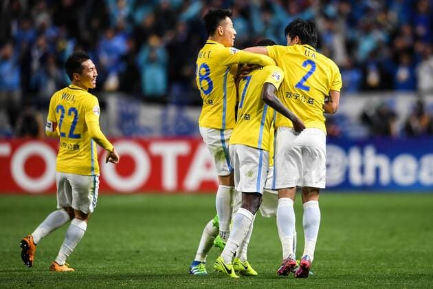 Players of China s Jiangsu Suning celebrate after scoring a goal against Japan s Gamba Osaka in their Group H match during the AFC Champions League 2017 in Osaka, Japan, 15 March 2017. Jiangsu Suning competes against Gamba Osaka at AFC group match  20170315_83254