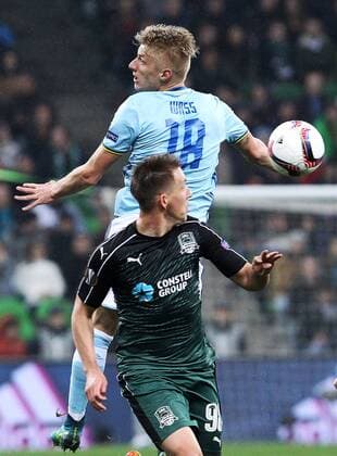KRASNODAR, RUSSIA - MARCH 16, 2017: FC Krasnodarâ€™s Sergei Petrov (front) and Celta de Vigoâ€™s Daniel Wass in action in their 2016-17 UEFA Europa League Round of 16 Leg 2 football match at Krasnodar Stadium. Vitaly Timkiv TASS  TS044865