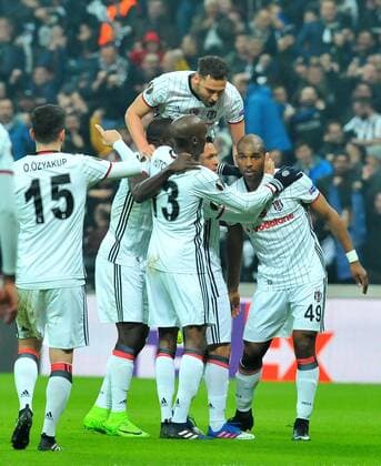 Besiktas players Ryan Babel and Vincent Aboubakar celebrates the victory during a Europa League round of 16 second leg soccer match at Vodafone Arena stadium in Istanbul, Thursday, March 16, 2017.(Tolga Adanali - Depo Photos)  15650169