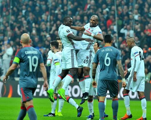 Besiktas players Ryan Babel and Vincent Aboubakar celebrates the victory during a Europa League round of 16 second leg soccer match at Vodafone Arena stadium in Istanbul, Thursday, March 16, 2017.(Tolga Adanali - Depo Photos)  15650174
