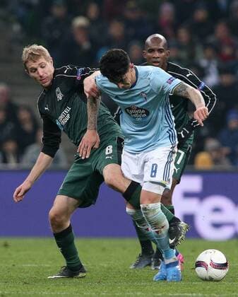KRASNODAR, RUSSIA - MARCH 16, 2017: FC Krasnodarâ€™s Yury Gazinsky (L) an Celta de Vigoâ€™s Pablo Hernandez fight for the ball in their 2016-17 UEFA Europa League Round of 16 Leg 2 football match at Krasnodar Stadium. Celta de Vigo won the game 2-0. Vitaly Timkiv TASS  TS04489A