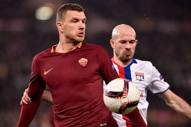 Edin Dzeko of AS Roma is challenged by Christophe Jallet of Olympique Lyonnais during the UEFA Europa League match between Roma and Olympique Lyonnais at Stadio Olimpico, Rome, Italy on 16 March 2017. Copyright: xGiuseppexMaffiax 14640025
