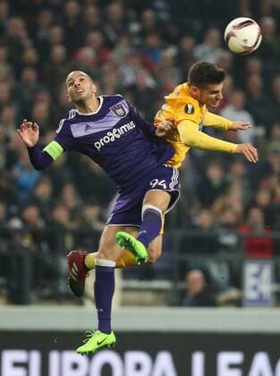Anderlecht s Sofiane Hanni and Apoel s Kostakis Artymatas fight for the ball during a return 1 8 final game of the Europa League competition between Belgian soccer team RSC Anderlecht and Cyprus team Apoel Nicosie in Anderlecht, Thursday 16 March 2017. First leg in Nicosie ended on a 0-1 result. VIRGINIExLEFOUR  x05066041x