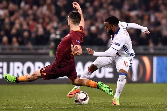 Alexandre Lacazette of Olympique Lyonnais is challenged by Konstantinos Manolas of AS Roma during the UEFA Europa League match between Roma and Olympique Lyonnais at Stadio Olimpico, Rome, Italy on 16 March 2017. Copyright: xGiuseppexMaffiax 14640037