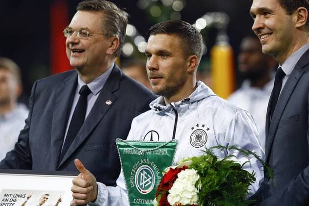 (l-r) German footbal manager Grindel, Lukas Podolski of Germany plays his last game for the national teamduring the friendly match between Germany and England on March 22, 2017 at the Signal Iduna Park stadium in Dortmund, Germany. Germany v England Friendly match 2016 2017 xVIxxIVx 7401214