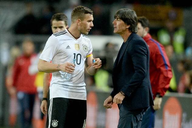 22.03.2017, xfux, Fussball Freundschaftsspiel, Deutschland - England, emspor, v.l. Lukas Podolski (Deutsche Fussball Nationalmannschaft DFB), Trainer Joachim JOGI Loew (Deutsche Fussball Nationalmannschaft DFB) Dortmund