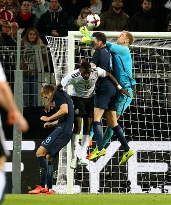 Joe Hart of England punches the ball clear under pressure from Antonio Rudiger of Germany during the International Friendly Länderspiel at Signal Iduna Park, Dortmund. Picture date: March 22nd, 2017. Pic credit should read: Matt McNulty Sportimage EDITORIAL USE ONLY. No use with unauthorised audio, video, data, fixture lists, club league logos or live services. Online in-match use limited to 120 images, no video emulation. No use in betting, games or single club league player publications.