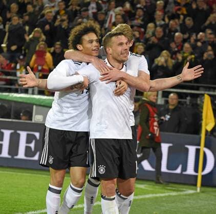 22.03.2017, Fussball Test-Länderspiel, Deutschland - England, in Dortmund, Signal-Iduna-Park-Stadion Dortmund, Torjubel Lukas Podolski (re, Deutschland). mit Andre Schürrle (Deutschland), und Leroy Sane (li, Deutschland). 