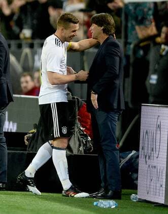 22.03.2017, xfux, Fussball Freundschaftsspiel, Deutschland - England, emspor, v.l. Lukas Podolski (Deutsche Fussball Nationalmannschaft DFB), Trainer Joachim JOGI Loew (Deutsche Fussball Nationalmannschaft DFB) jubelnd bejubelt jubelt jubeln Dortmund