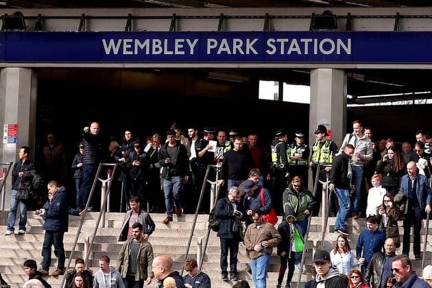 Armed police guard the Wembley Park tube station entrance during the Group F World Cup Qualifier at Wembley Stadium, London. Picture date: March 26th, 2017. Pic credit should read: Matt McNulty Sportimage EDITORIAL USE ONLY. No use with unauthorised audio, video, data, fixture lists, club league logos or live services. Online in-match use limited to 120 images, no video emulation. No use in betting, games or single club league player publications.