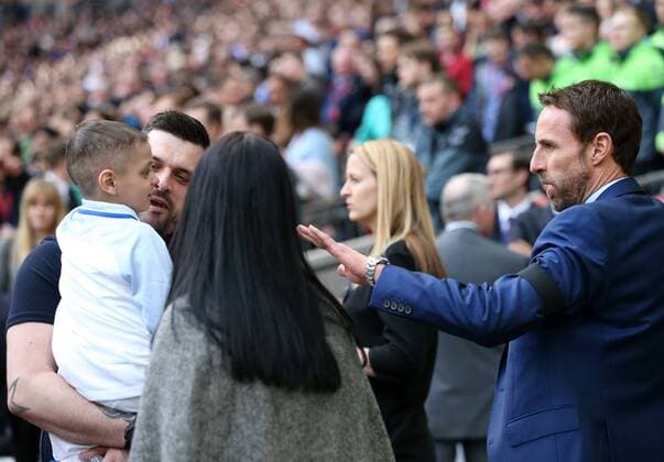 Bradley Lowery speaks with Gareth Southgate during the World Cup Qualifying match at Wembley Stadium, London. Picture date: March 26th, 2017. Pic credit should read: David Klein Sportimage EDITORIAL USE ONLY. No use with unauthorised audio, video, data, fixture lists, club league logos or live services. Online in-match use limited to 120 images, no video emulation. No use in betting, games or single club league player publications.