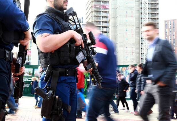 Armed police patrol outside Wembley Stadium before the England v Lithuania World Cup Qualifier played at Wembley Stadium, on March 26, 2017. 