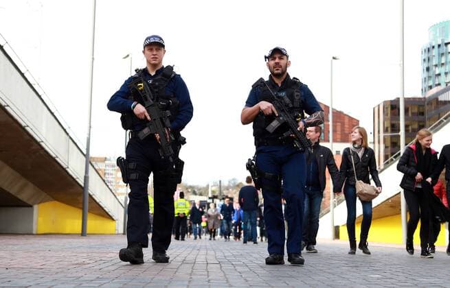 Armed police patrol outside Wembley Stadium before the England v Lithuania World Cup Qualifier played at Wembley Stadium, on March 26, 2017. 
