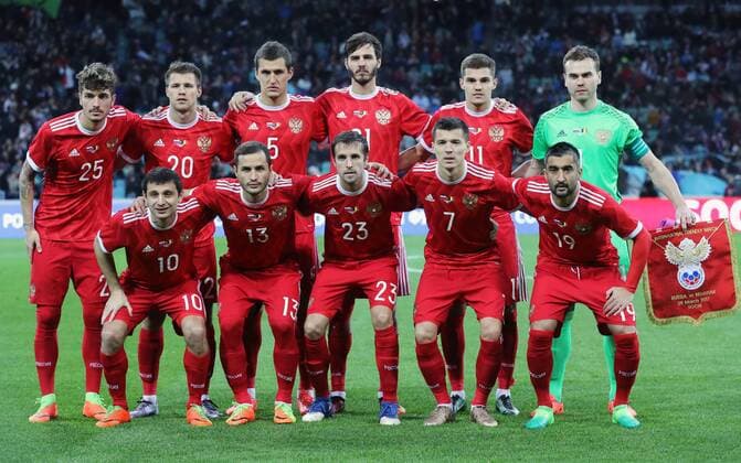 SOCHI, RUSSIA - MARCH 28, 2017: Russia s Alan Dzagoev, Fyodor Kudryashov, Dmitry Kombarov, Dmitry Poloz, Alexander Samedov (L-R front), Roman Neustadter, Maxim Kanunnikov, Viktor Vasin, Alexander Yerokhin, Roman Zobnin, and goalkeeper Igor Akinfeev (L-R back) pose for a group photo ahead of a friendly football match against Belgium at Fisht Stadium. Artyom Korotayev TASS TS045D62