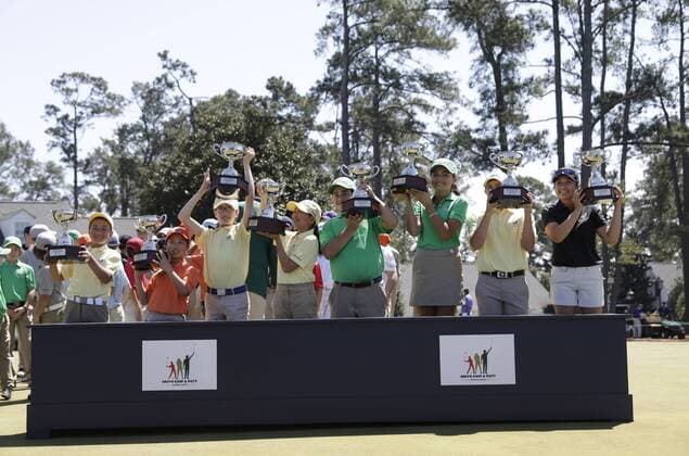 The winners from all age groups of the Drive, Chip & Putt Championship raise their trophies at the trophy ceremony at the 2017 Masters Tournament at Augusta National Golf Club in Augusta, Georgia on April 2, 2017.  AUG20170402120 JOHNxANGELILLO