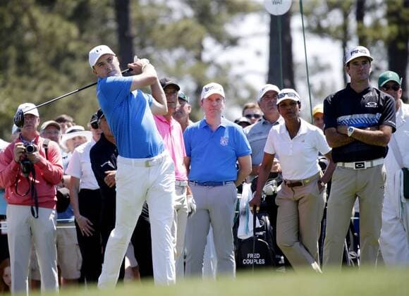 Former United States Secretary of State Condoleezza Rice and Bubba Watson watch Jordan Spieth hit a tee shot while playing a practice round at the 2017 Masters Tournament at Augusta National Golf Club in Augusta, Georgia on April 2, 2017.  AUG20170402110 JOHNxANGELILLO
