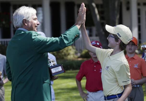 Freddie Couples high fives Liam Hartling who is the overall winner of the Boys 10-11 age group in the Drive, Chip & Putt Championship at the 2017 Masters Tournament at Augusta National Golf Club in Augusta, Georgia on April 2, 2017.  AUG20170402119 JOHNxANGELILLO