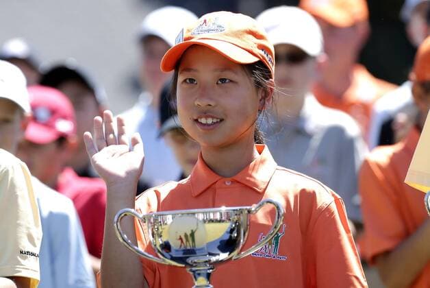 Maye Huang overall winner of the Girls 7-9 age group Drive, Chip & Putt Championship waves at the trophy ceremony at the 2017 Masters Tournament at Augusta National Golf Club in Augusta, Georgia on April 2, 2017.  AUG20170402125 JOHNxANGELILLO