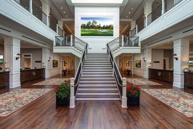 The grand staircase welcomes press into the new Press Building at Augusta National Golf Club. The new facility boasts a state of the art Working Arena and Interview Room, expanded suites for television, radio and photographers, new gentlemen and ladies locker rooms and a full-service restaurant.  AUG20170402141 MILLERxBROWN