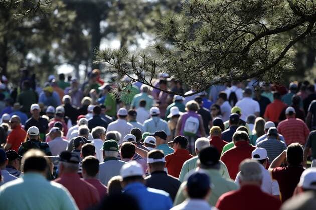 Patrons walk on the golf course in the morning for a practice round on Tuesday at the 2017 Masters Tournament at Augusta National Golf Club in Augusta, Georgia on April 4, 2017.  AUG20170404128 JOHNxANGELILLO