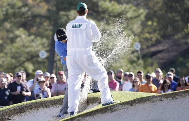 Jon Rahm of Spain hits a ball that landed close to the lip of the bunker at a practice round on Tuesday at the 2017 Masters Tournament at Augusta National Golf Club in Augusta, Georgia on April 4, 2017.  AUG20170404126 JOHNxANGELILLO