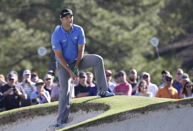Jon Rahm of Spain prepares to hit a ball that landed close to the lip of the bunker at a practice round on Tuesday at the 2017 Masters Tournament at Augusta National Golf Club in Augusta, Georgia on April 4, 2017.  AUG20170404127 JOHNxANGELILLO