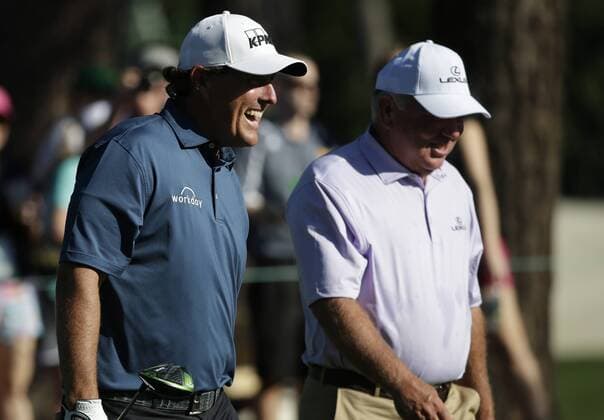 Phil Mickelson and Mark O Meara smile as they walk from the tee box at a practice round on Tuesday at the 2017 Masters Tournament at Augusta National Golf Club in Augusta, Georgia on April 4, 2017.  AUG20170404130 JOHNxANGELILLO