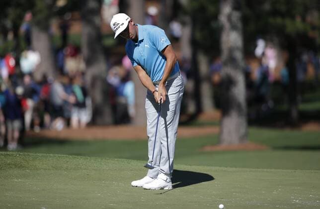 Rickie Fowler hits a putt at a practice round on Tuesday at the 2017 Masters Tournament at Augusta National Golf Club in Augusta, Georgia on April 4, 2017.  AUG20170404107 JOHNxANGELILLO