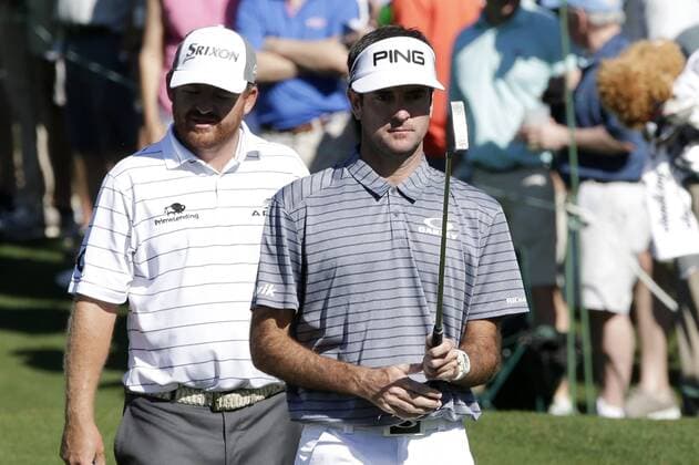 Bubba Watson looks at his putter at a practice round on Tuesday at the 2017 Masters Tournament at Augusta National Golf Club in Augusta, Georgia on April 4, 2017.  AUG20170404109 JOHNxANGELILLO