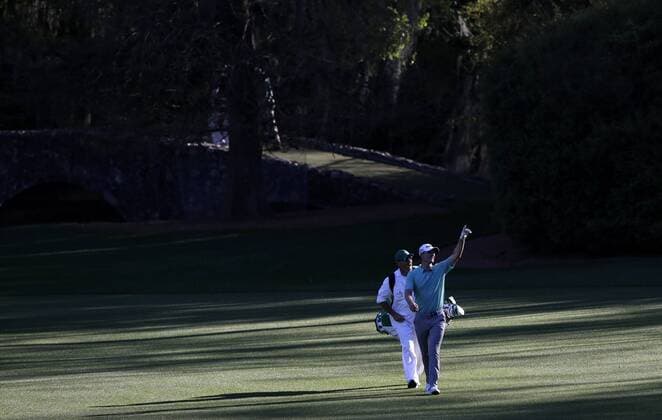 Justin Rose of Great Britain and caddie Mark Fulchera walk on the 13th hole fairway in a practice round on Tuesday at the 2017 Masters Tournament at Augusta National Golf Club in Augusta, Georgia on April 4, 2017.  AUG20170404150 JOHNxANGELILLO