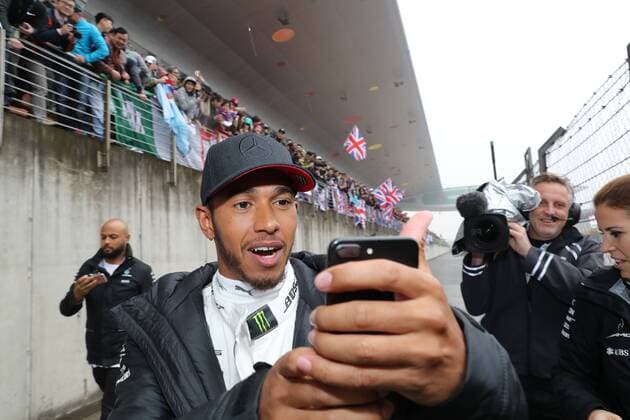 British F1 driver Lewis Hamilton of Mercedes takes selfies at the Shanghai International Circuit in Shanghai, China, 7 April 2017. Lewis Hamilton fascinates fans with gifts in Shanghai  20170407_62531